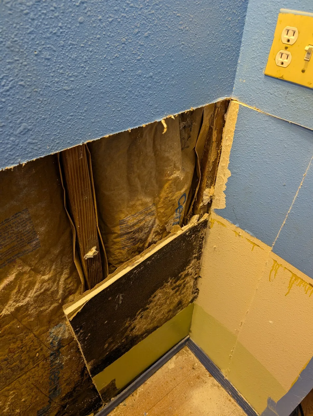 A flood cut carried through the corner where two painted walls meet.