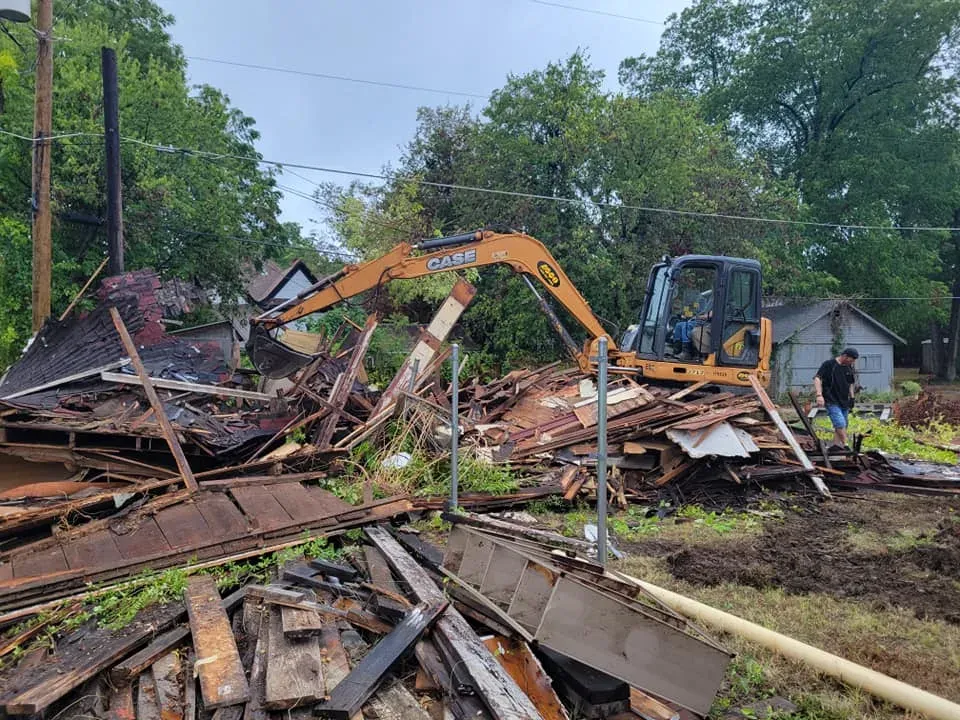 Storm-damaged structure being torn out after water intrusion
